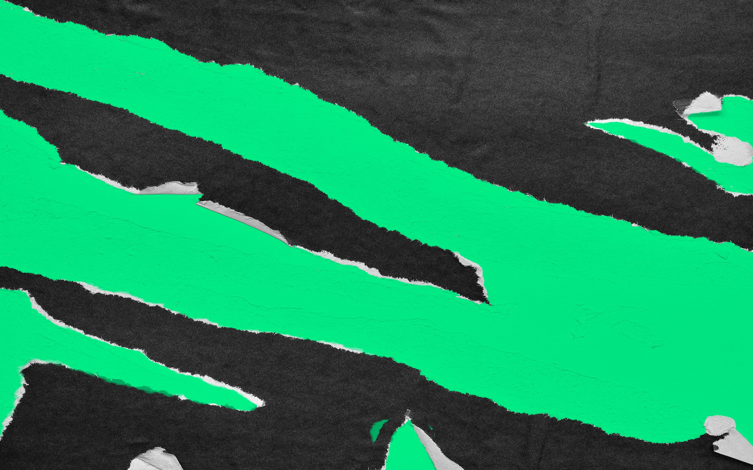 black billboard paper peeling over neon green paper